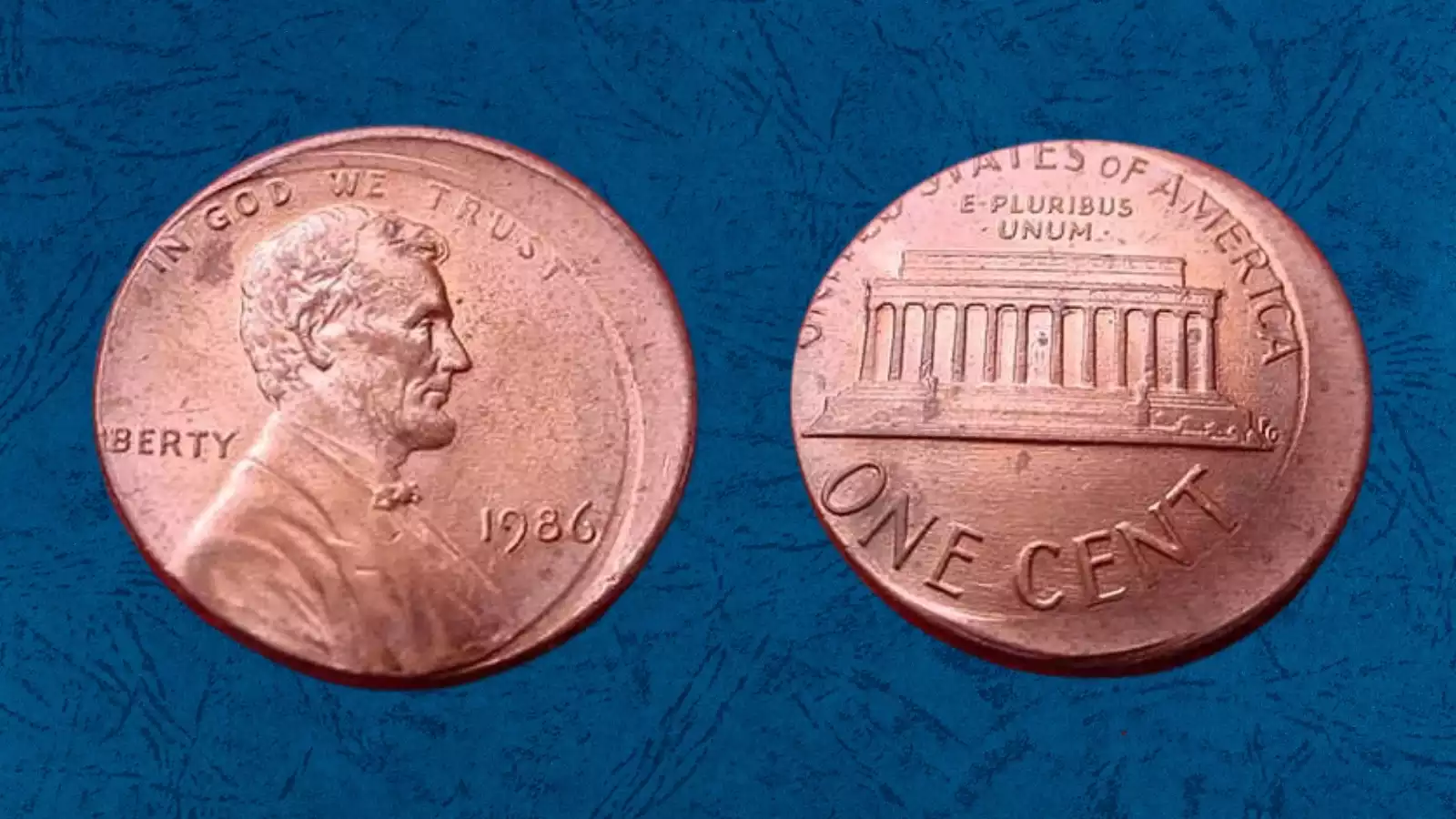 1986 Lincoln penny off-center strike error with design shifted approximately 30 percent off-center showing blank planchet crescent