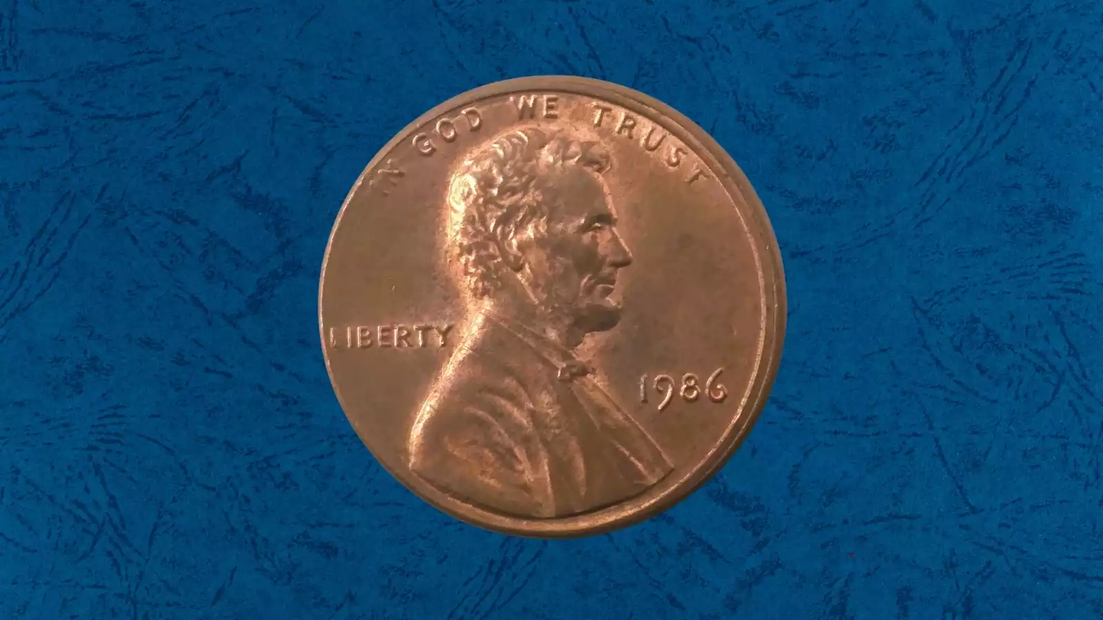 1986 Lincoln penny broadstrike error showing expanded diameter and flattened rim from being struck outside the retaining collar